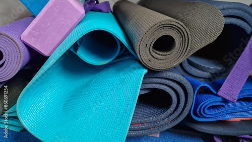 Pile of rolled up yoga mats