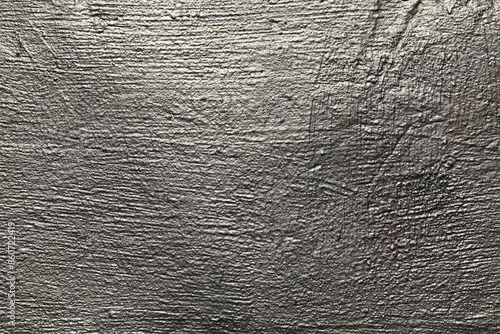 Silver metallic wall, background, texture. Uneven, grooved and embossed silvery backdrop. Grey surface with silver porous color. Abstract, lumpy and textured surface. Vintage blanch sketches. Platinum photo