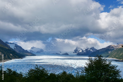 View of Perito Moreno Glacier with clouds and mountains in the background, Los Glaciares National Park, Argentina © Fearless on 4 Wheels