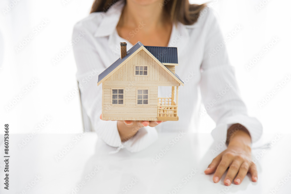 Small toy house in hands. Your new house Small toy house in hands. Your new house