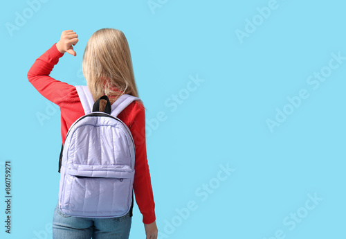 Cute schoolgirl with backpa...