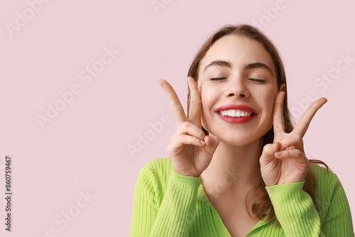 Pretty young woman showing ...