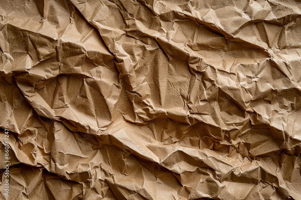 A close-up of crumpled brown cardboard texture showcases the rugged and tactile surface, characterized by its folds, creases, and natural patterns A close-up of crumpled brown cardboard texture showcases the rugged and tactile surface, characterized by its folds, creases, and natural patterns