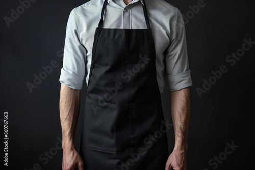 A minimalist black apron template serves as an ideal backdrop for showcasing designs or branding