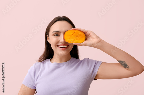 Smiling young woman holding...
