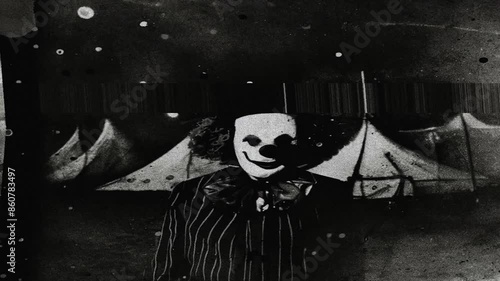 Creepy spooky clown with dust and scratches on tv scrren glitch effect
