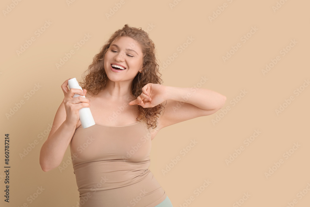 Happy young woman with deodorant on beige background Happy young woman with deodorant on beige background