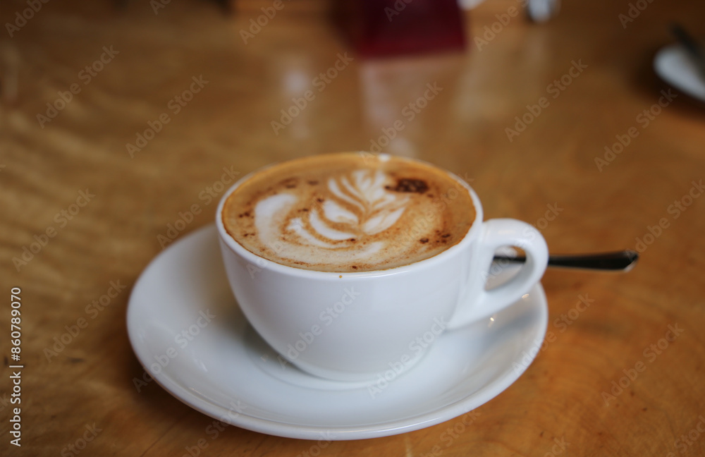 Feshly brewed latte coffee on a wooden table Feshly brewed latte coffee on a wooden table