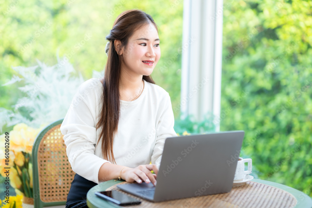 asian freelance people business female talking making using casual working with laptop computer for browsing internet, chatting and blogging and smartphone,notebook in coffee shop. asian freelance people business female talking making using casual working with laptop computer for browsing internet, chatting and blogging and smartphone,notebook in coffee shop.