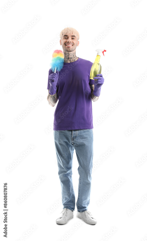 Young tattooed man with bottle of detergent and pp-duster on white background Young tattooed man with bottle of detergent and pp-duster on white background