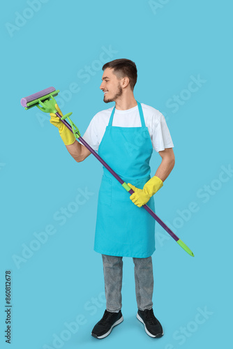 Male janitor with floor mop...