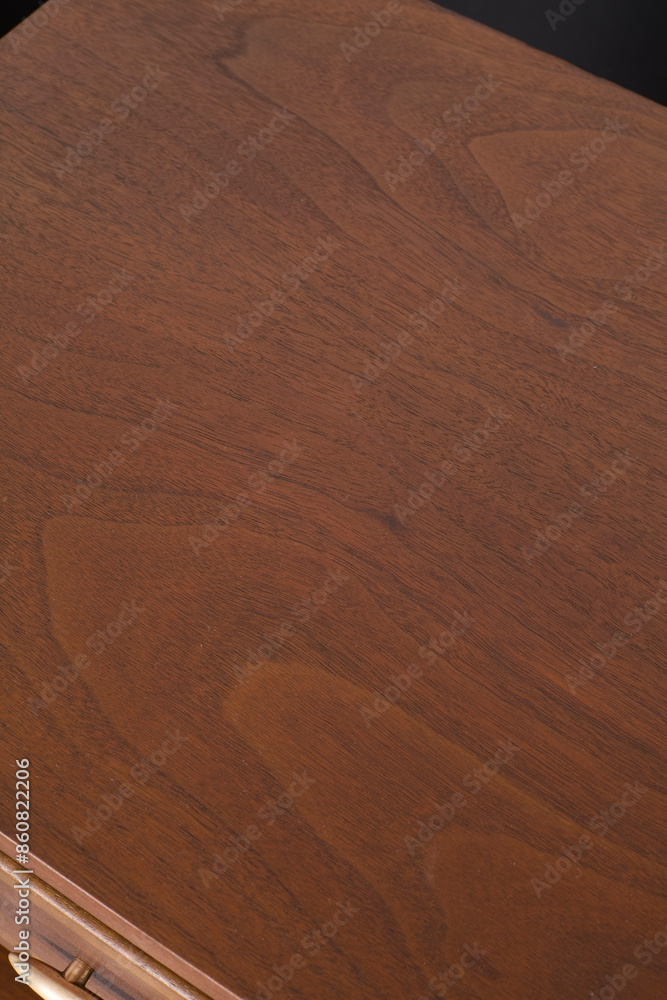 Naklejka premium Dark walnut wood grain texture. Vertical wood pattern banner photograph.