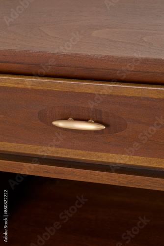 Vintage 1960s nightstand with classic styling. Walnut furniture with expressive grain pattern. Close-up detail product photograph.