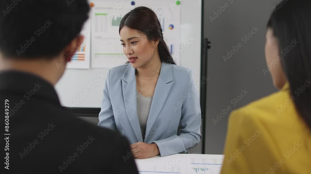 Business meeting, Asian businesswoman talking during a meeting with colleagues to discuss planning new business projects. Business meeting, Asian businesswoman talking during a meeting with colleagues to discuss planning new business projects.