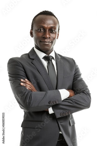 A professional businessman poses for a photo, dressed in formal attire