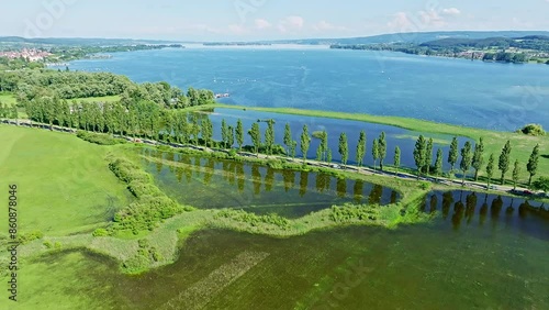 Aerial view of the Radolfzell Aachried at high tide with the Mooser Damm, which connects the town and the surrounding area of Radolfzell with the Hoeri peninsula. On the horizon to the left is the photo