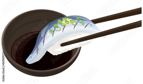 光り物の寿司を醤油につける