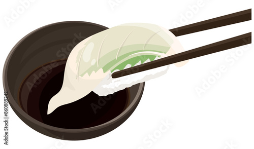 イカの寿司を醤油につける