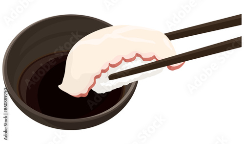 タコの寿司を醤油につける