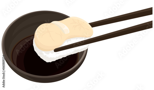 ホタテの握り寿司を醤油につける