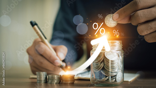 Obraz na plátne Businessman is calculating income and return on investment in percentage