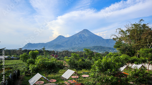 Backyard cafe  with a beautiful view of Mount Penanggungan in the morning.  photo