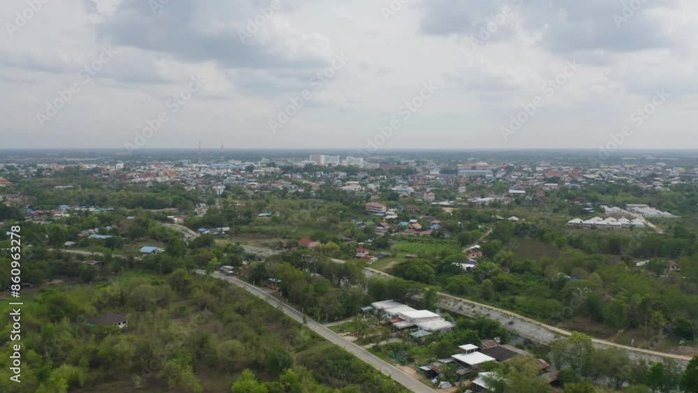 Aerial view of local residential neighborhood roofs. Urban housing development from above. Top view. Real estate in Isan urban city town, Thailand. Property real estate. Aerial view of local residential neighborhood roofs. Urban housing development from above. Top view. Real estate in Isan urban city town, Thailand. Property real estate.