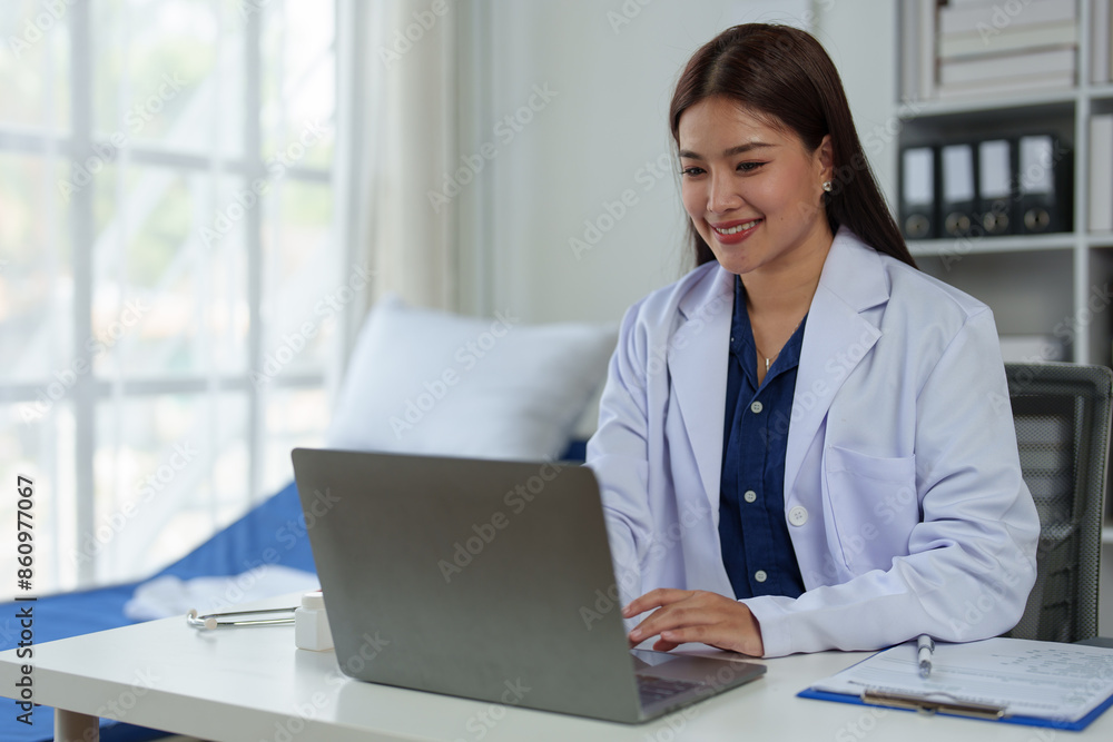 Expert Asian female doctor Professional and dedicated woman is working and reading medical research results on her laptop, studying medicine in office at hospital. Expert Asian female doctor Professional and dedicated woman is working and reading medical research results on her laptop, studying medicine in office at hospital.