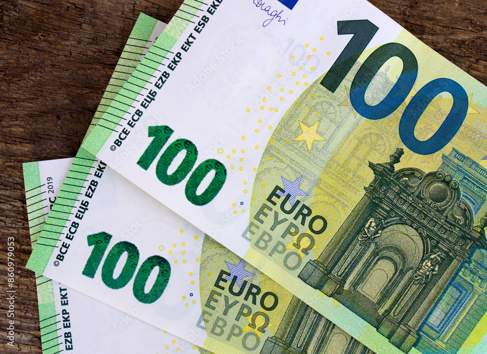 A fragment of a hundred euro banknote close-up on a retro background