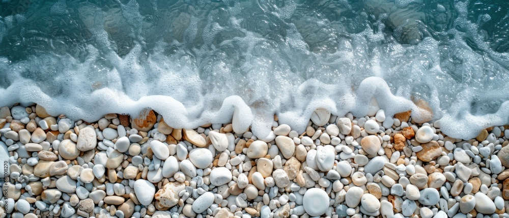 photo of a beach made of smooth stones. water, minimalism photo of a beach made of smooth stones. water, minimalism
