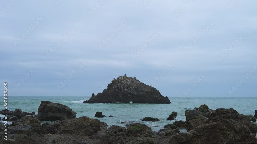 Sea stacks at the beach on a foggy morning, Aichi Prefecture, Japan Sea stacks at the beach on a foggy morning, Aichi Prefecture, Japan