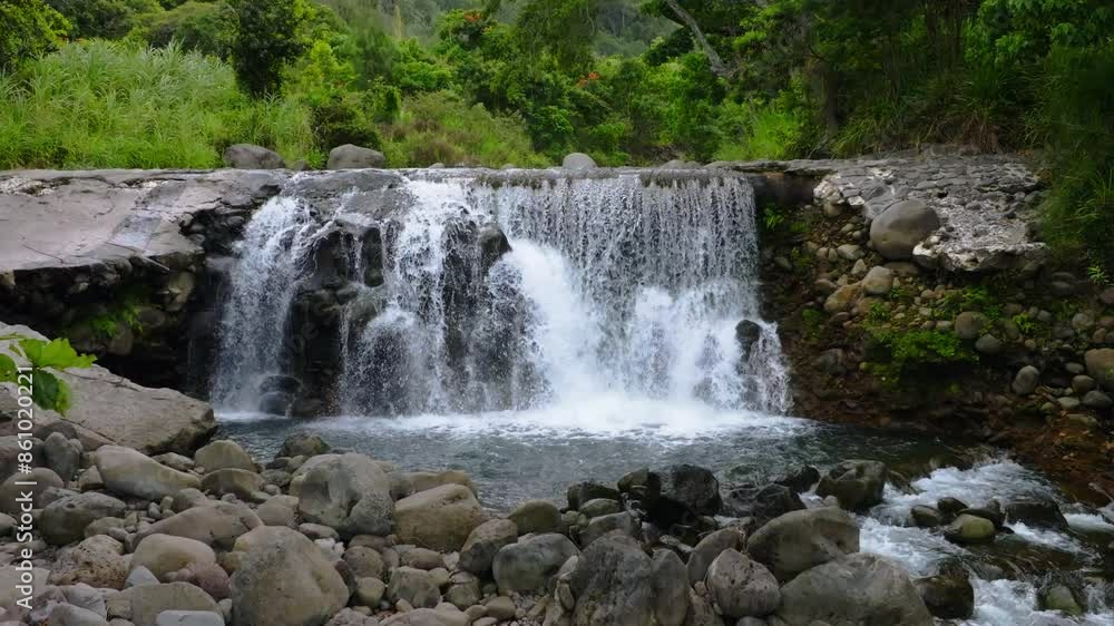 Spectacular Waterfall At Happy Valley Pond. Freshwater Cascading Over Large Rocks Down The Wailuku River Stream In The Iao Valley Of West Maui. Aerial Zoom In. Spectacular Waterfall At Happy Valley Pond. Freshwater Cascading Over Large Rocks Down The Wailuku River Stream In The Iao Valley Of West Maui. Aerial Zoom In.