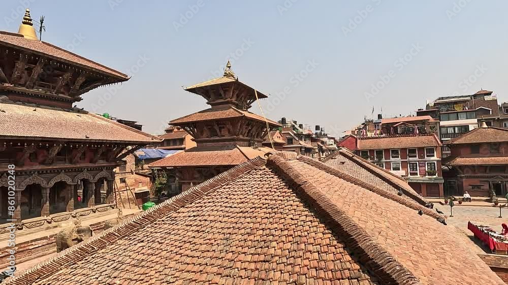 View over the temple roof tiles of Patan Darbar Square. Lalitpur in Kathmandu Valley, Nepal. Krishna Mandir, Bhimsen, Char Narayan, Pyamha Narandya View over the temple roof tiles of Patan Darbar Square. Lalitpur in Kathmandu Valley, Nepal. Krishna Mandir, Bhimsen, Char Narayan, Pyamha Narandya