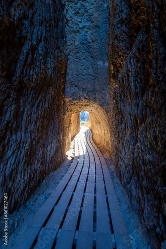 Gallery carved into the rock in the Roman aqueduct of Peña Cortada. Valencian Community, Spain.