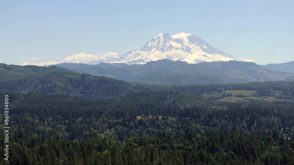 Mount Rainier in the Distance with Lush Forested Foreground on a Clear Day Mount Rainier in the Distance with Lush Forested Foreground on a Clear Day
