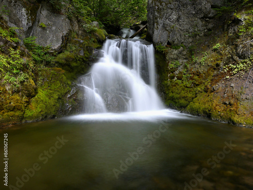 Waterfall in the forest in New Zealand, mysterious scene long exposure time