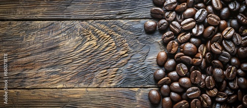 Coffee beans on wood backgr...