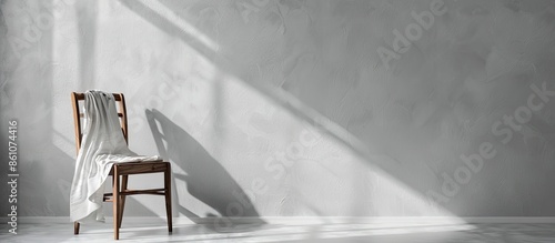 Clothes on chair on gray wa...