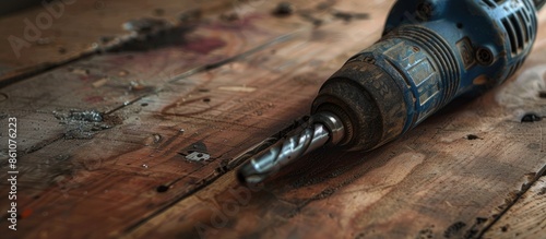 Dark blue drill on a wooden...