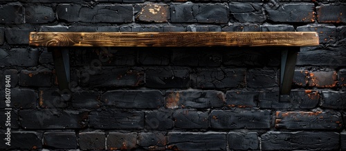 Wooden shelf over dark bric...
