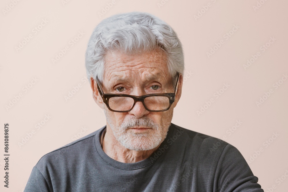 Serious teacher wearing glasses, isolated on pink Serious teacher wearing glasses, isolated on pink