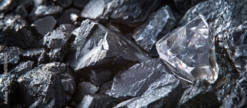 diamond mine with rough diamond stone, cut diamond and carbon or graphite ore, on kimberlite rocks, transformation into rare stone concept. Copy space image. Place for adding text or design