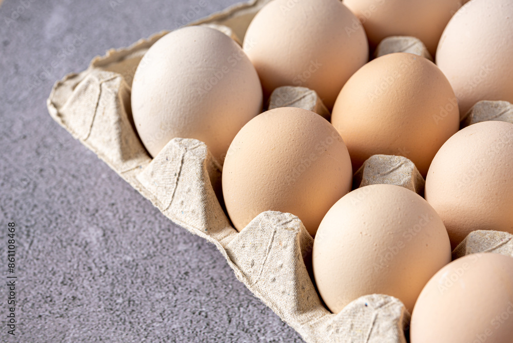Brown eggs stacked in rows.Group of Fresh white Eggs in a cardboard cassette. Organic food from nature good for health. Brown eggs stacked in rows.Group of Fresh white Eggs in a cardboard cassette. Organic food from nature good for health.