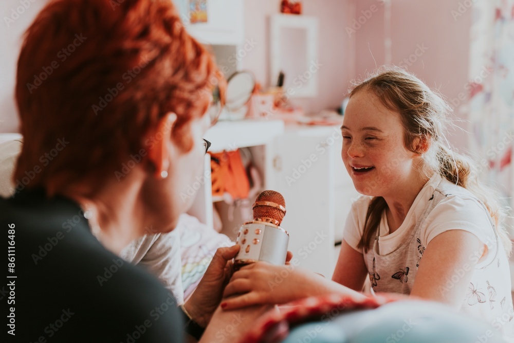 Girl with Down Syndrome and mother playing Girl with Down Syndrome and mother playing
