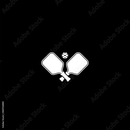 Two pickleball paddles and ball icon isolated on dark background