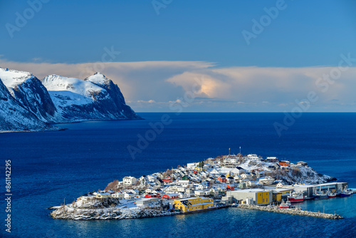 Village on island of Senja amidst Norwegian sea at Troms in Norway photo