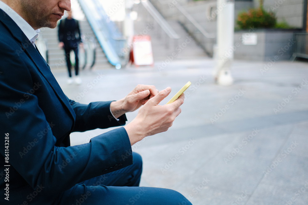Businessman using smart phone on street Businessman using smart phone on street