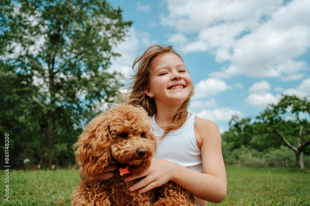 Smiling girl with Maltipoo dog in farm Smiling girl with Maltipoo dog in farm
