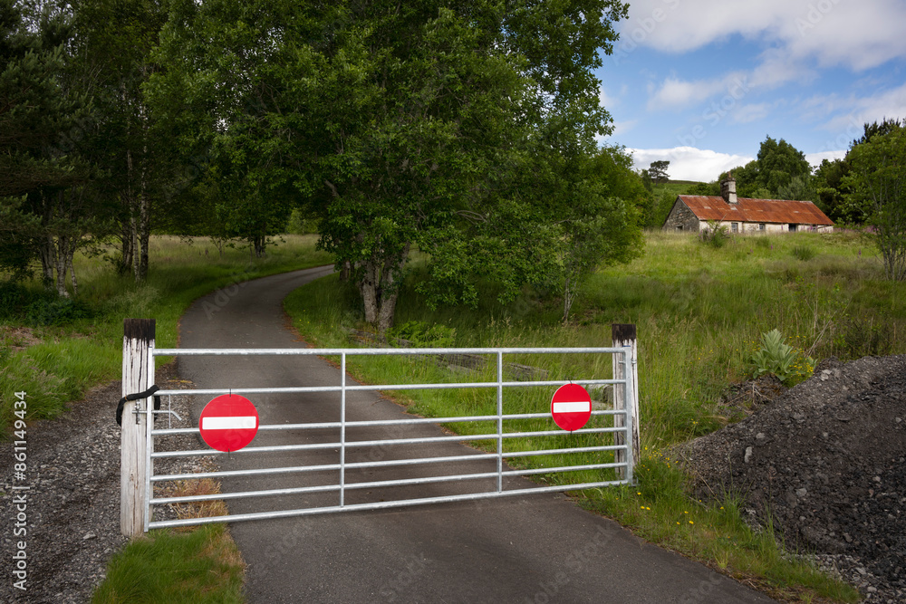Fencing gate with warning sign prohibiting entry in forest Fencing gate with warning sign prohibiting entry in forest