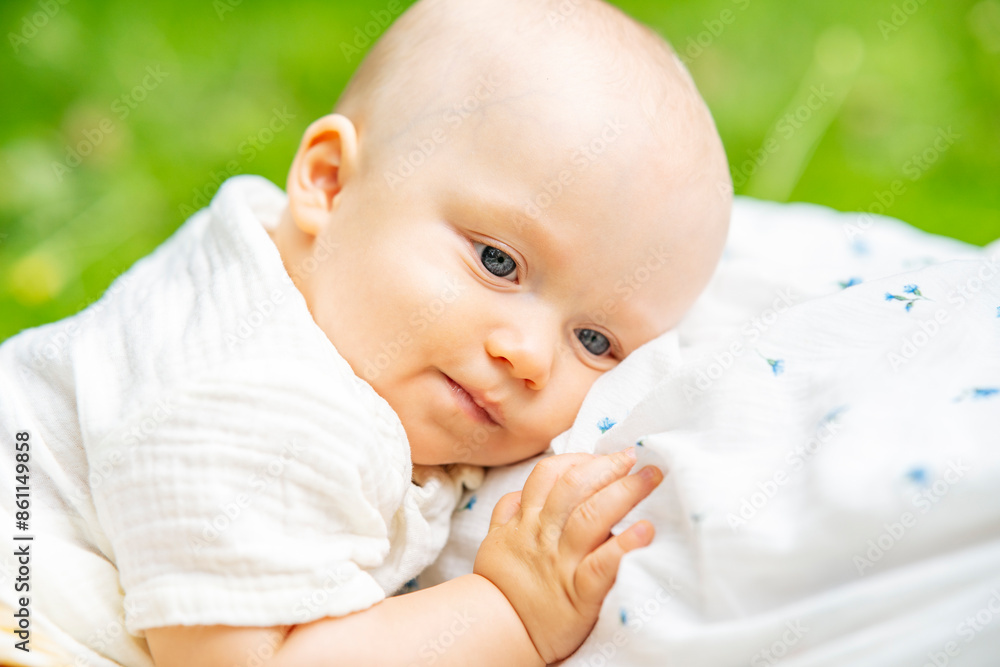 Cute baby boy lying in garden Cute baby boy lying in garden